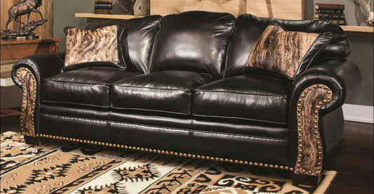 Three Seat Leather Sofa With Rounded Arms And Curved Sofa Back.
